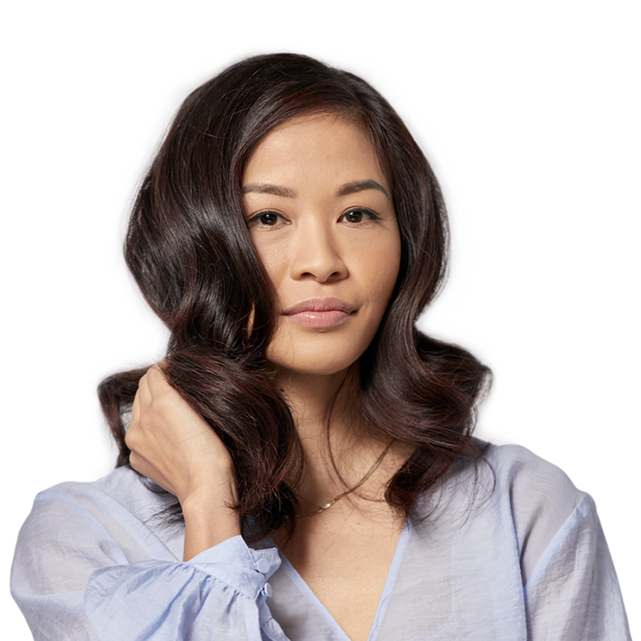model with long wavy hair showing off her hair colour
